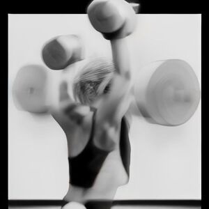 Mario wery muscular working out in a gym